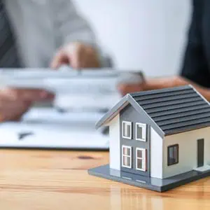 A model house on a table, symbolizing estate planning