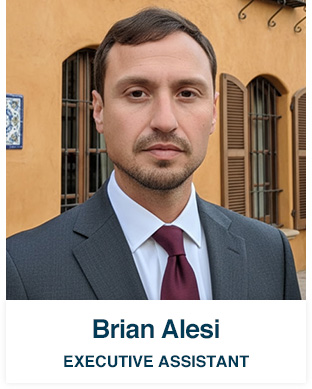 Professional headshot of Brian Alesi, Executive Assistant, in a suit and tie. 