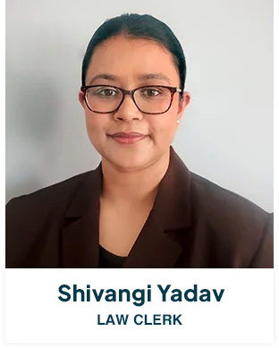 Professional headshot of Shivangi Yadav, a Law Clerk, wearing glasses and a brown blazer.